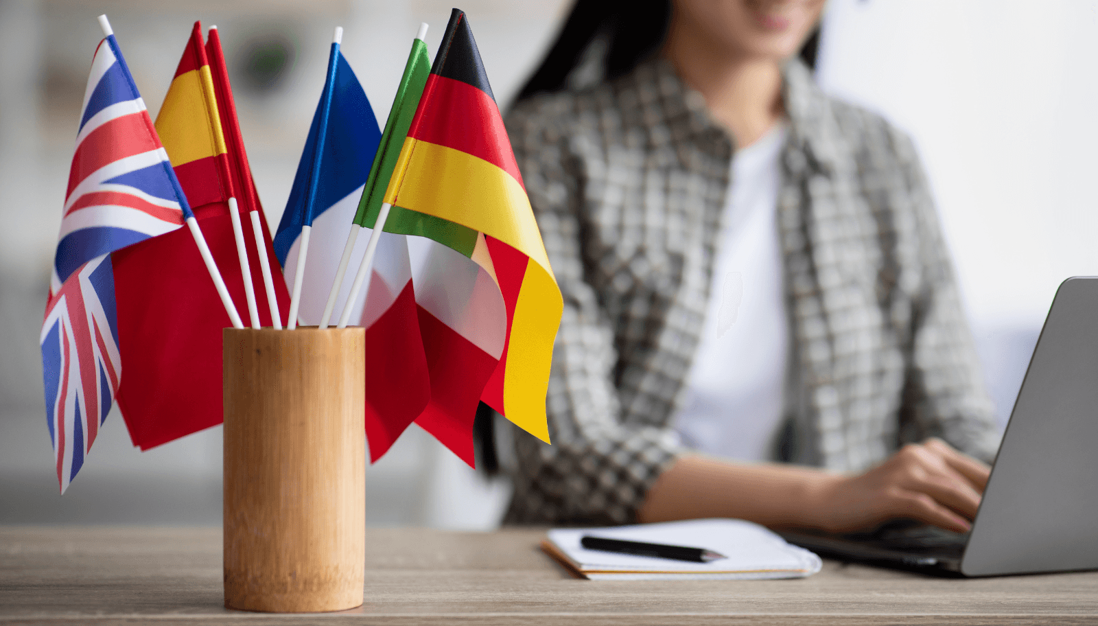 Hotel front desk staff handling guest questions in multiple languages