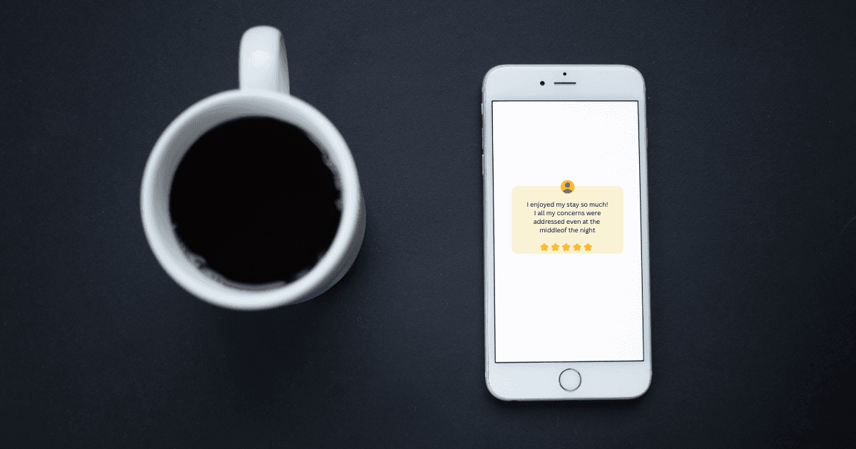 Five-star review on a phone screen beside a departure-morning coffee cup